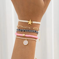 Conjunto de pulsera y pendientes con dije de estrella